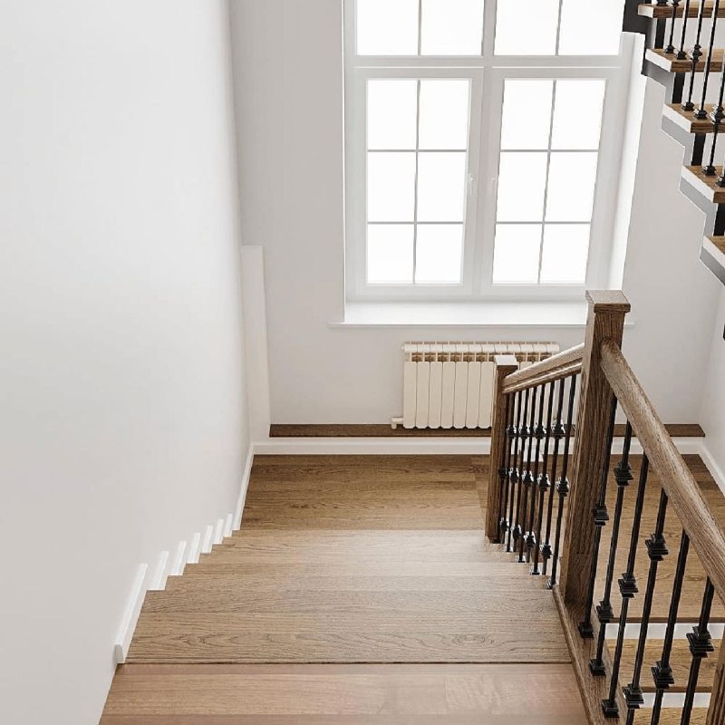 Г-образная лестница с радиусным поворотом и дубовыми ступенями